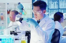asian scientist team conduct experiment in the laboratory