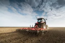 Tractor preparing land for sowing
