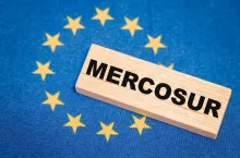 The flag of the European Union and the word Mercosur in the background. A financial and business concept. A trade agreement between the countries of the South and the European Union